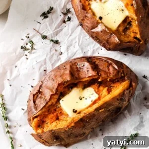 Crispy Air Fryer Sweet Potatoes: Quick Roast in 20 Minutes 14 overhead view of Air Fryer Baked Sweet Potato on a countertop and parchment paper.