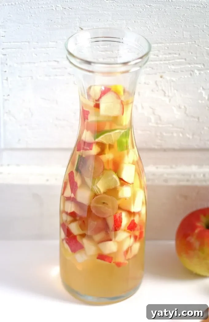 Crisp White Wine and Apple Cider Sangria Recipe 4 White wine apple cider sangria is the perfect addition to fall brunches. Grab your ingredients and try this recipe today! | honeyandbirch.com