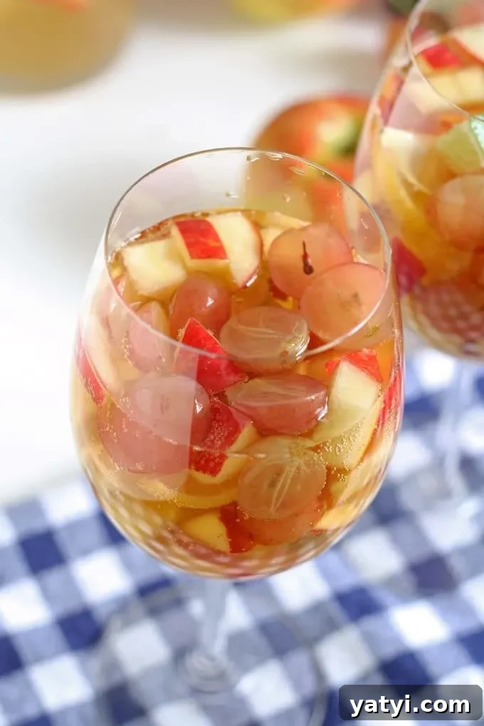 Crisp White Wine and Apple Cider Sangria Recipe 5 White wine apple cider sangria is the perfect addition to fall brunches. Grab your ingredients and try this recipe today! | honeyandbirch.com