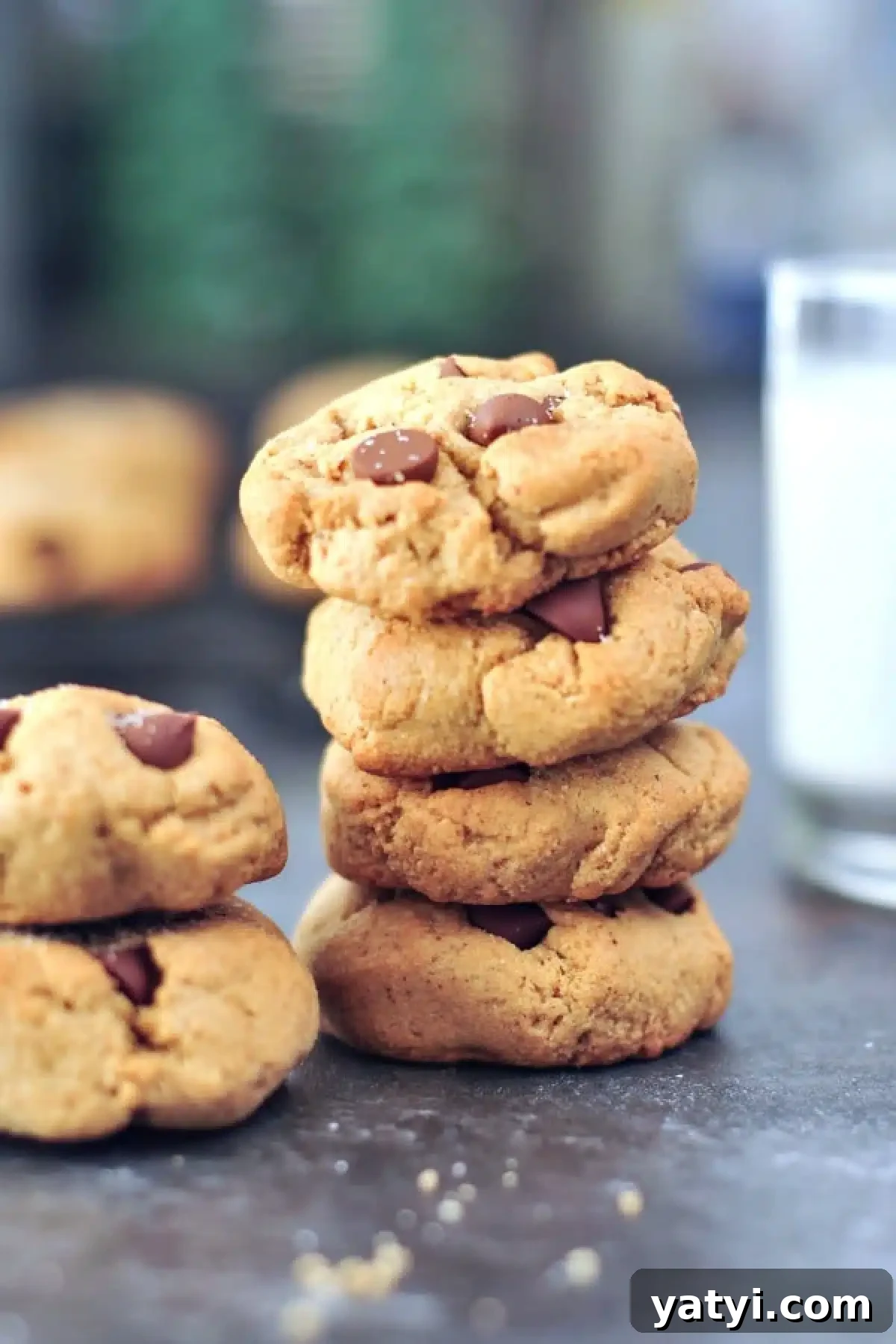 Flourless Chocolate Chip Cookies @spabettie A stack of flourless chocolate chip cookies with a glass of milk.
