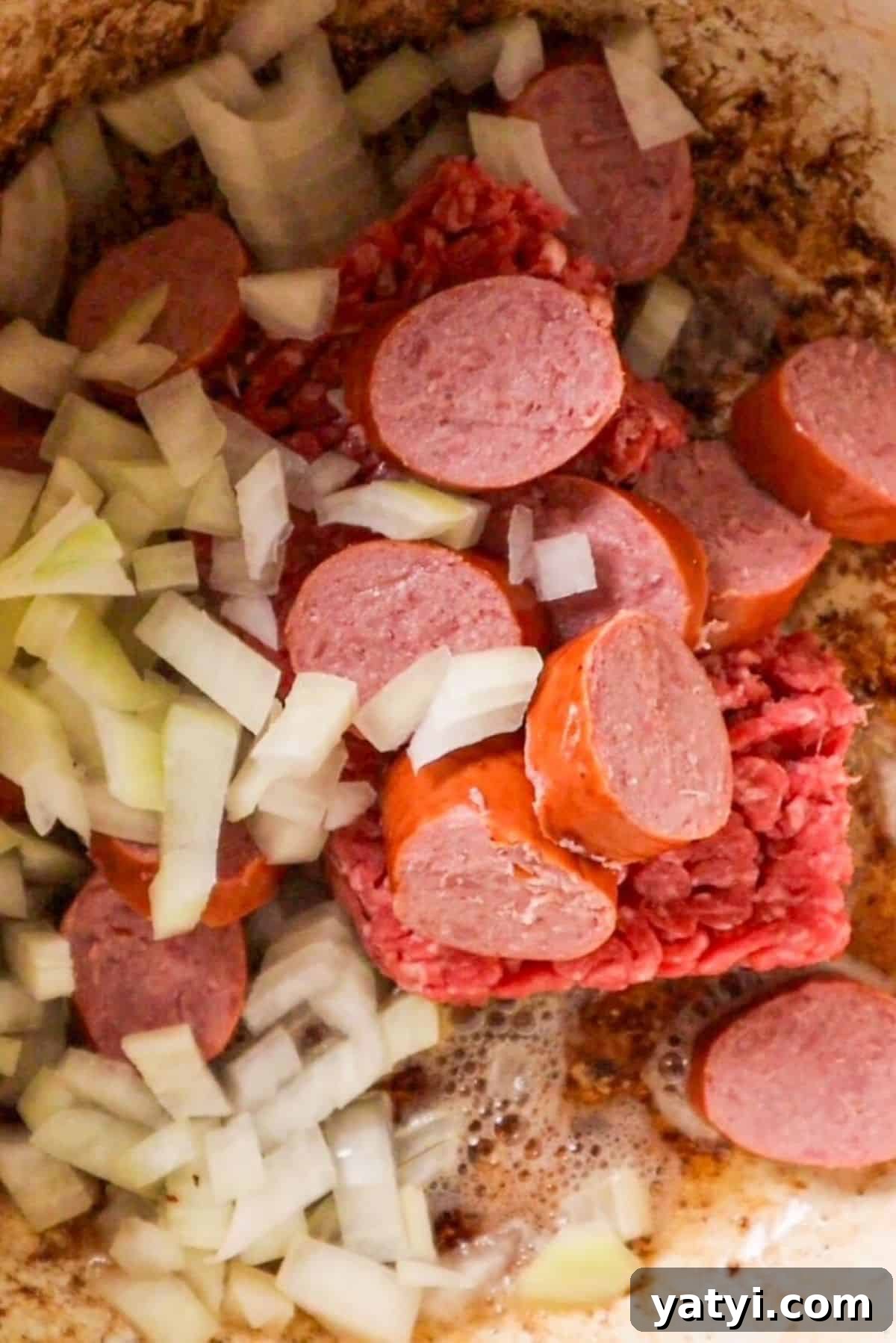 Smoky Baked Cowboy Beans with Brown Sugar and Bacon 3 sausage onions and beef for cowboy beans