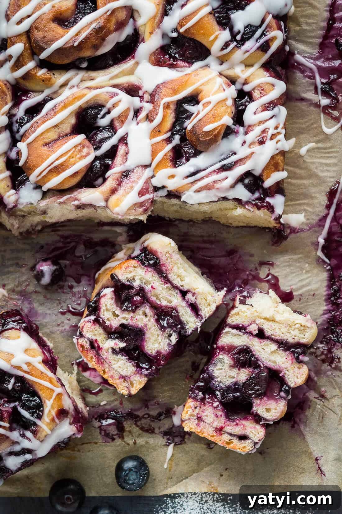 Citrus Lemon Blueberry Rolls (Vegan) 3 Vegan lemon blueberry sweet rolls filled with blueberry jam and fresh blueberries, topped with a lemon glaze.