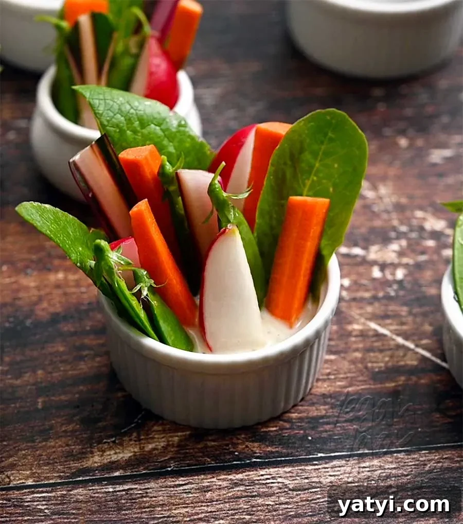 Vegan Holiday Afternoon Tea Menu & Festive Recipes 13 Veggie sticks and greens sticking out of a ramekin