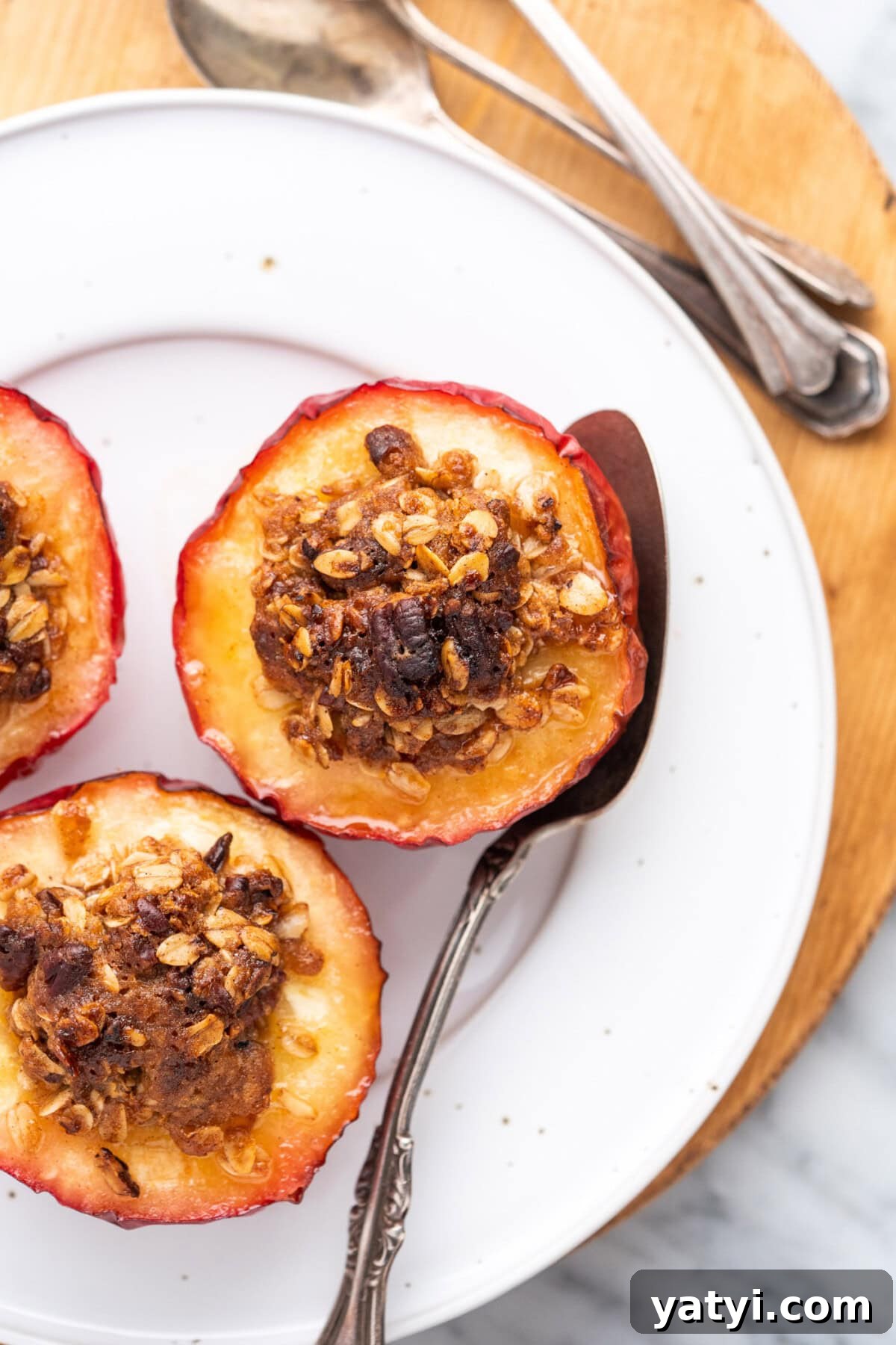 Cinnamon-Stuffed Baked Apples Made in the Air Fryer 2 Air Fryer Baked Apples on a white plate