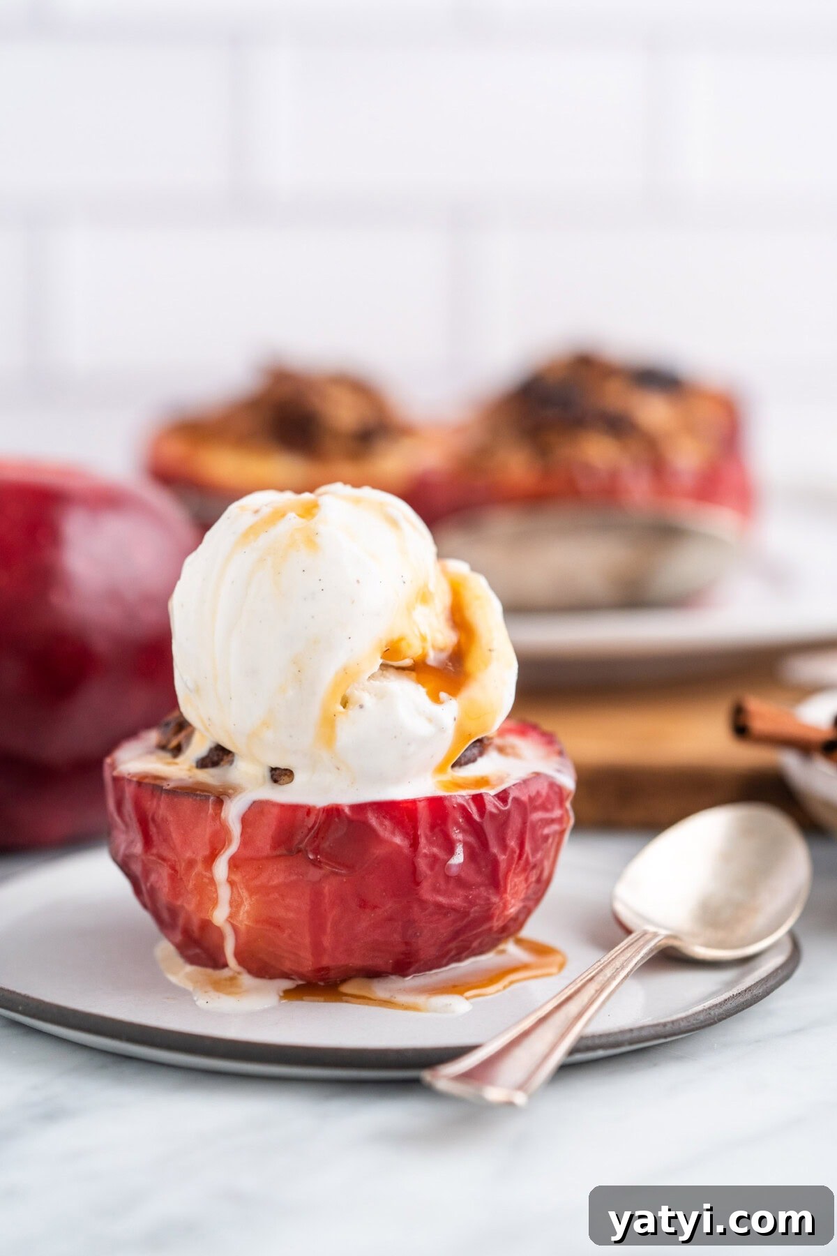 Cinnamon-Stuffed Baked Apples Made in the Air Fryer 11 Air Fryer Baked Apple with ice cream on top