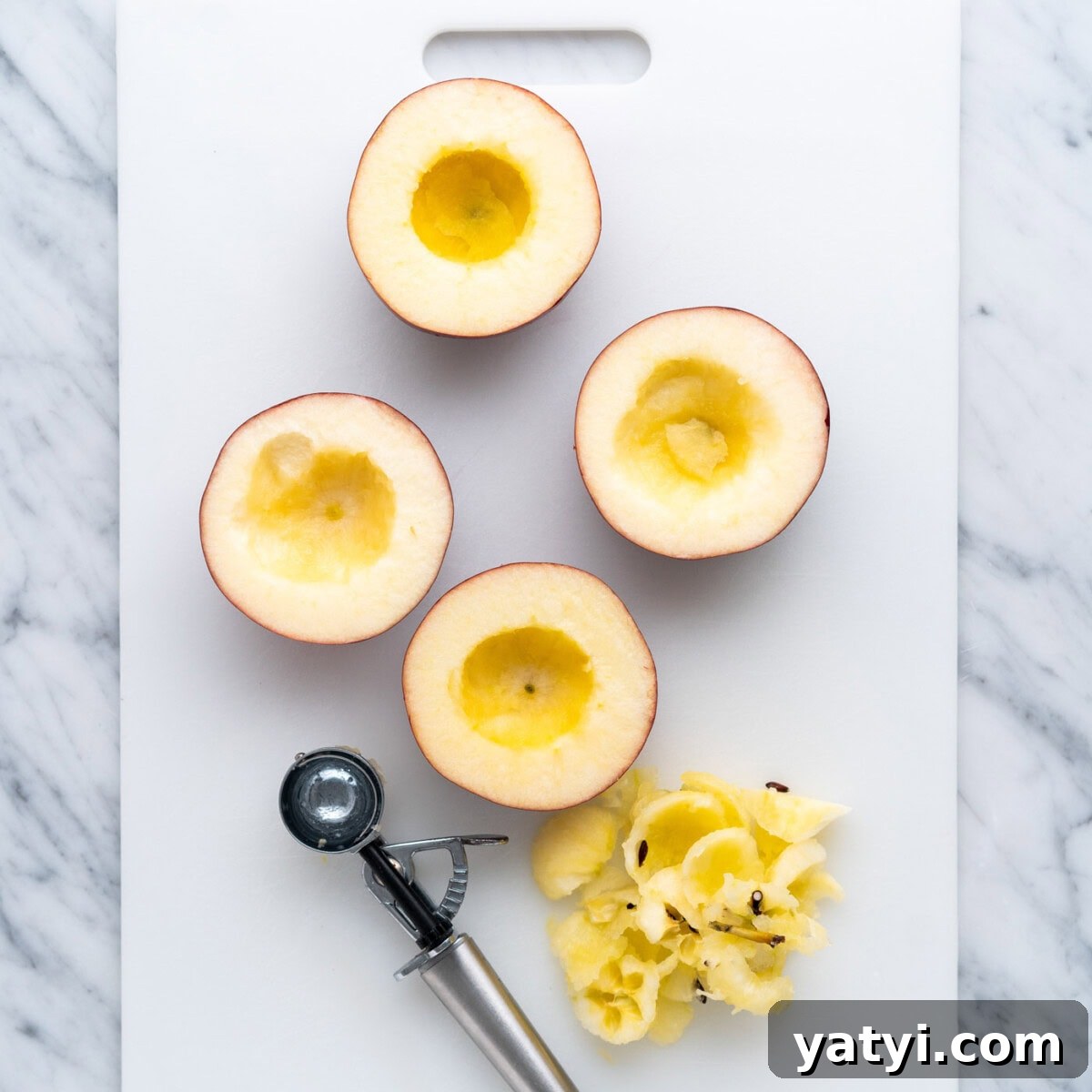 Cinnamon-Stuffed Baked Apples Made in the Air Fryer 6 cored apple halves using a melon baller