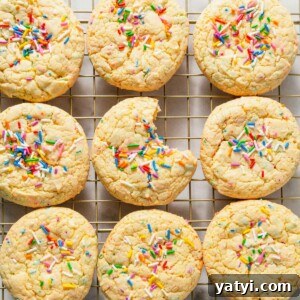 Chewy Yellow Cake Mix Cookies Recipe with Simple Ingredients 12 yellow cake mix cookies on a cooling rack.