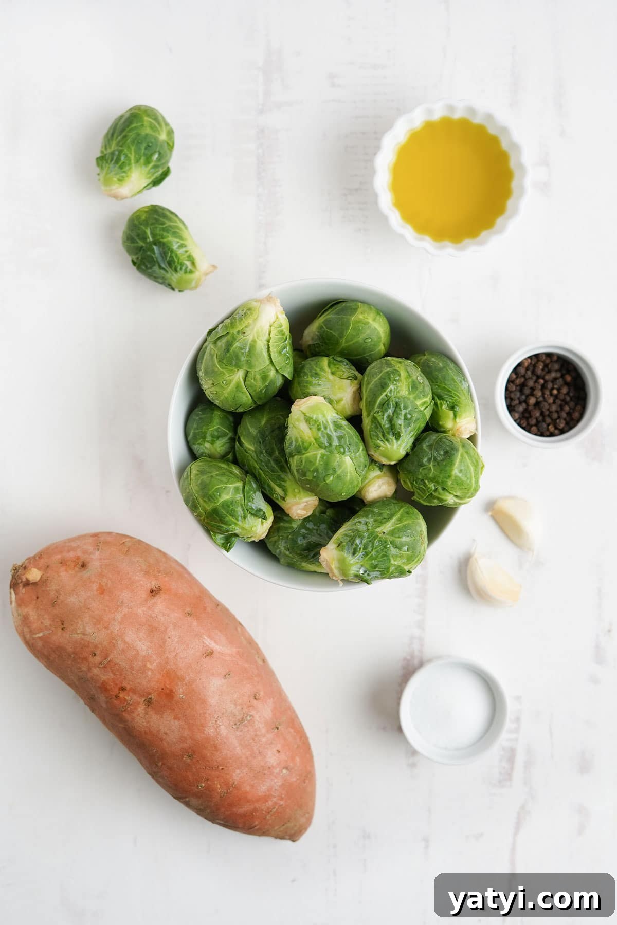 Crispy Roasted Brussels Sprouts with Maple-Roasted Sweet Potatoes 3 Ingredients to make brussel sprouts and sweet potatoes.