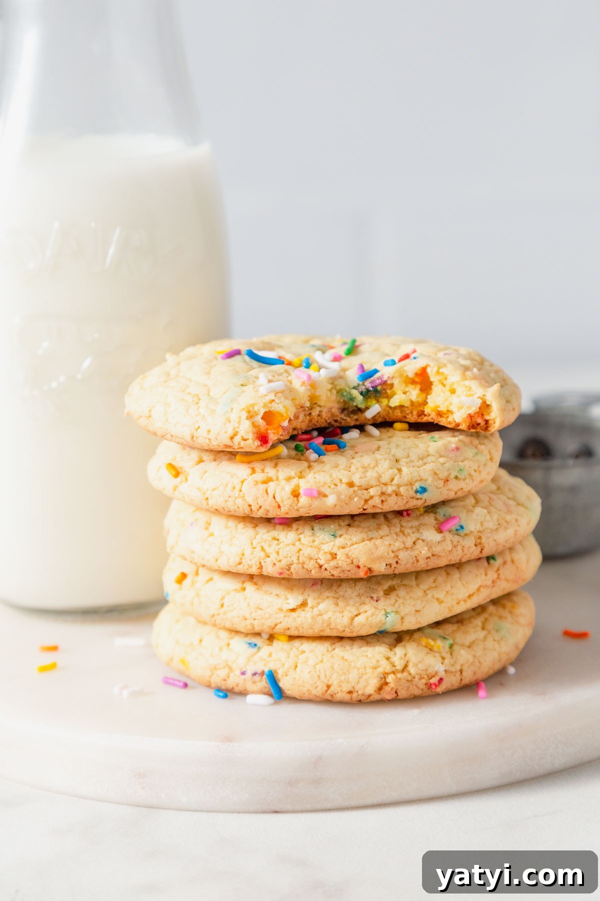 Chewy Yellow Cake Mix Cookies Recipe with Simple Ingredients 9 yellow cake mix cookies with a glass of milk.