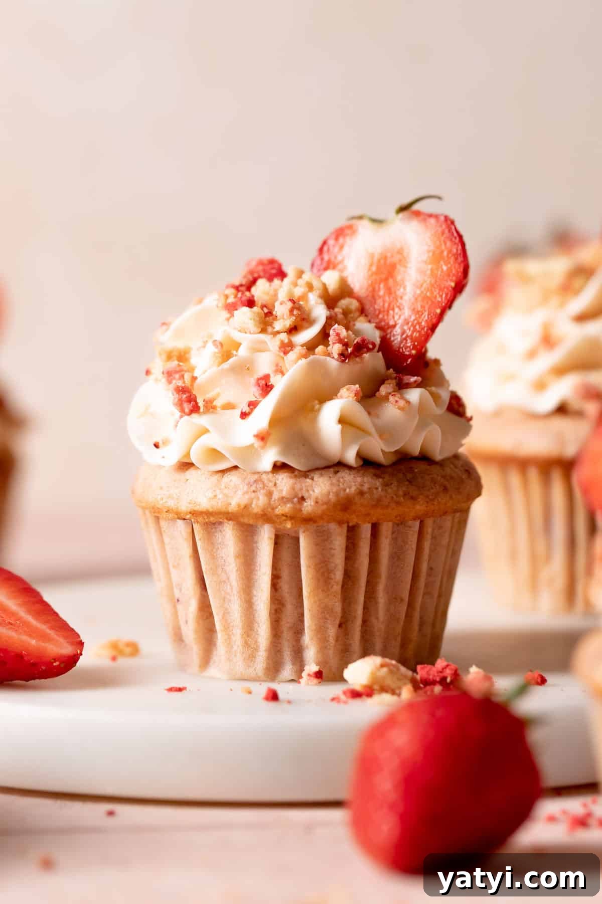 Strawberry Crunch Cupcakes Recipe with Crispy Topping 2 strawberry crunch cupcake with vanilla frosting and crunch topping.