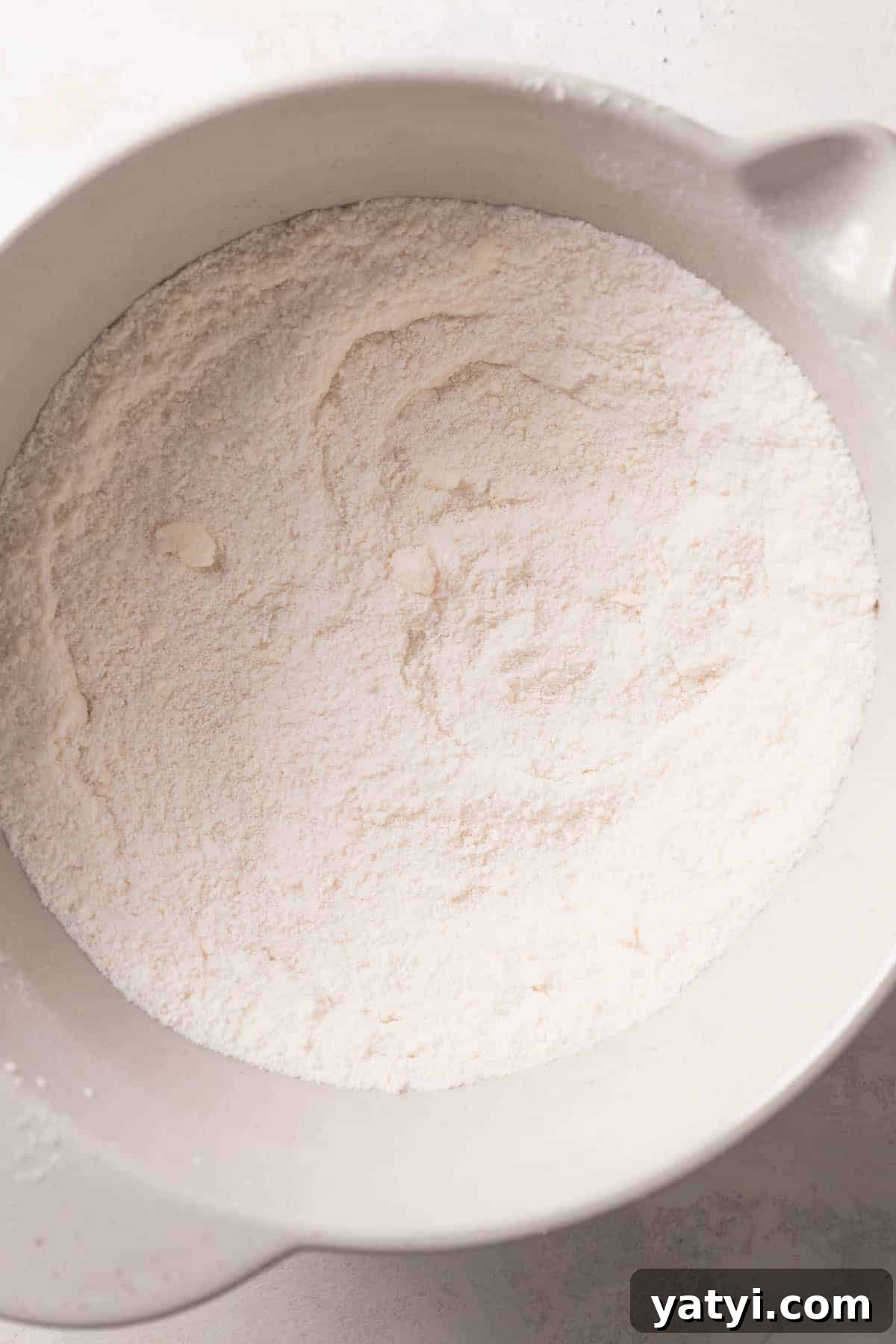 Strawberry Crunch Cupcakes Recipe with Crispy Topping 5 mixing bowl with dry ingredients and butter.