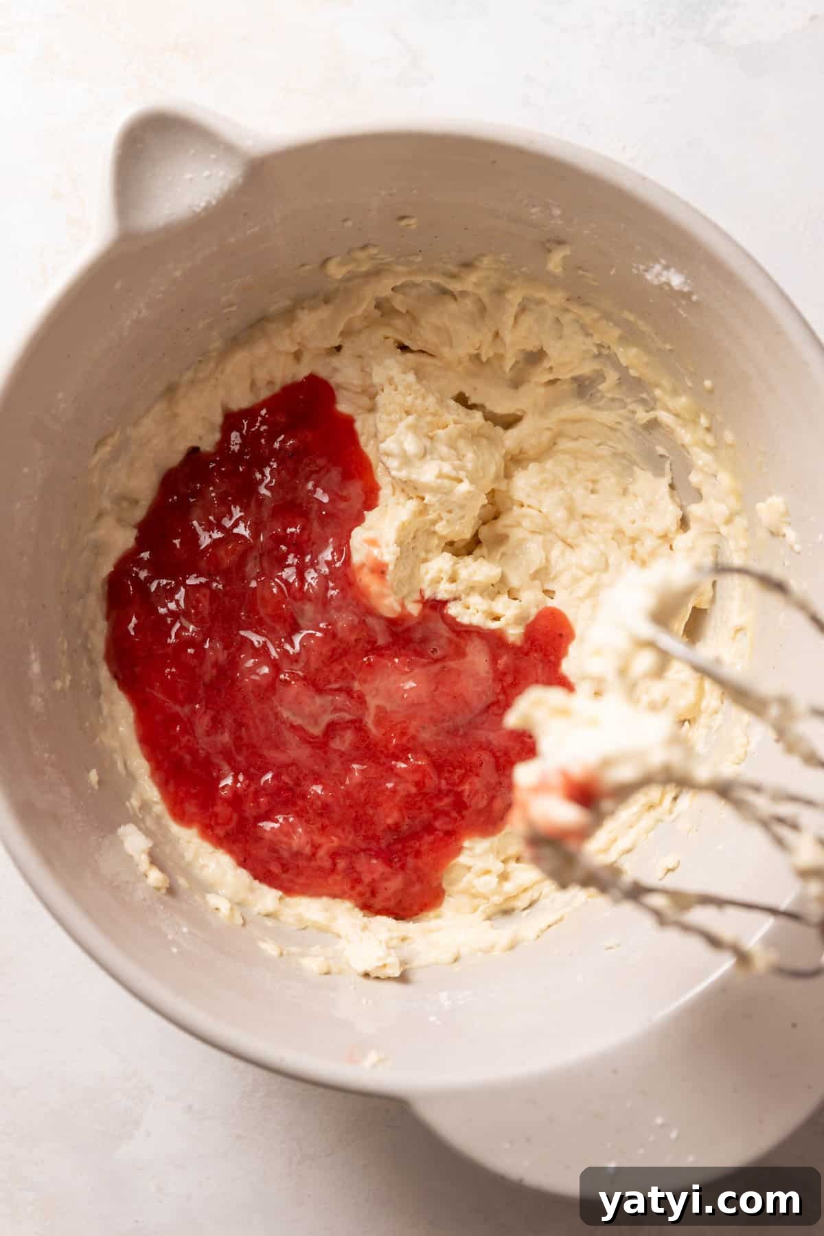Strawberry Crunch Cupcakes Recipe with Crispy Topping 7 strawberry puree on top of the cake batter before mixing it in.