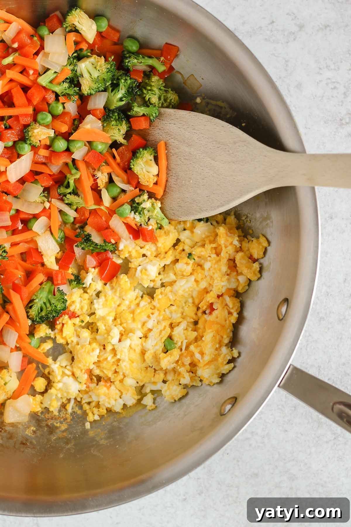 Low-Sodium Fried Rice Without Soy Sauce — Flavorful Vegetable Fried Rice 6 Sauteed fried rice veggies and scrambled eggs in a cast iron skillet.