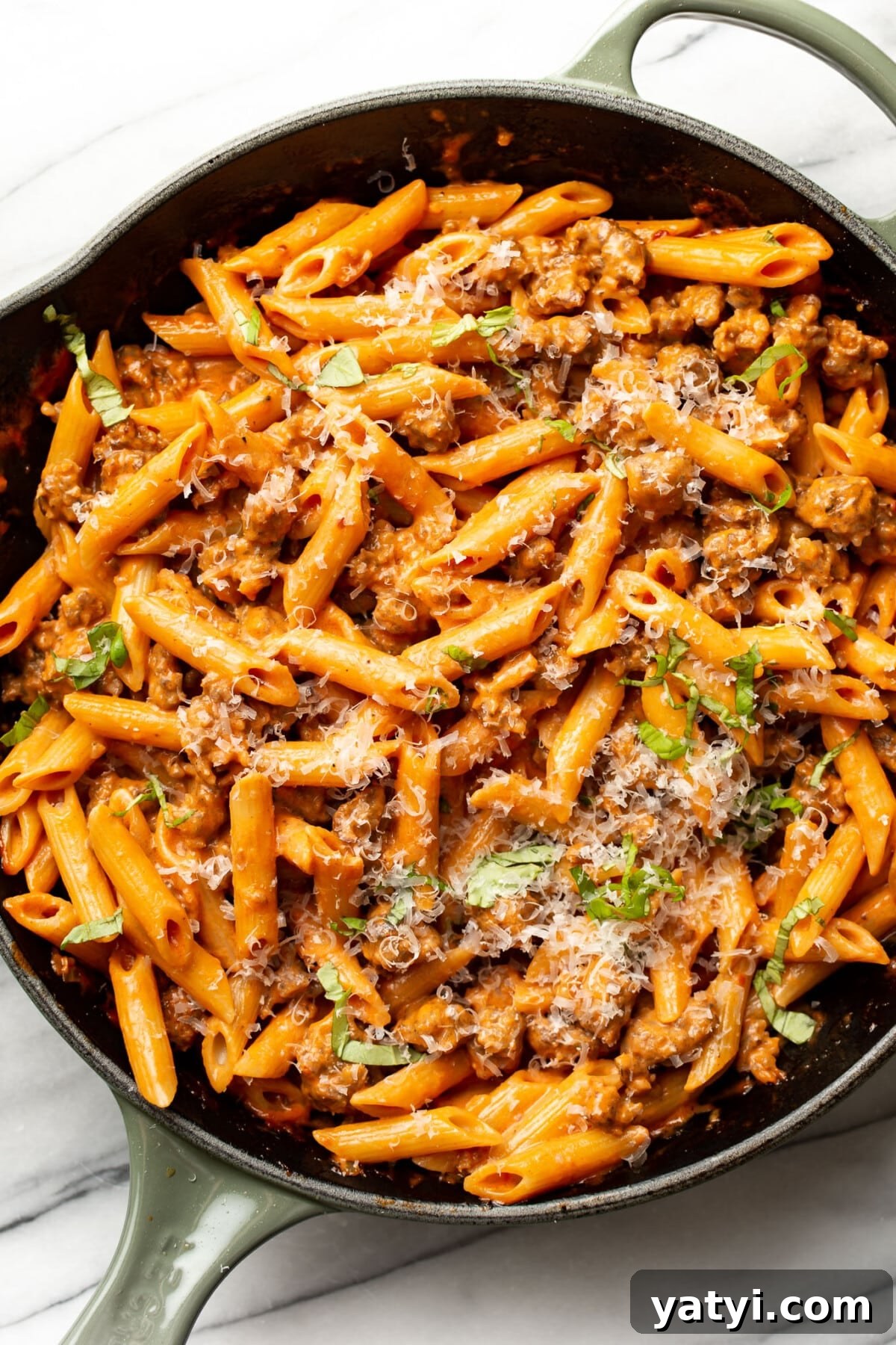 Sausage Penne alla Vodka: Creamy Tomato Pasta Recipe 6 a skillet with penne alla vodka with italian sausage