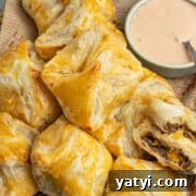 This is a square picture of the cheeseburger puff pastry bites.
