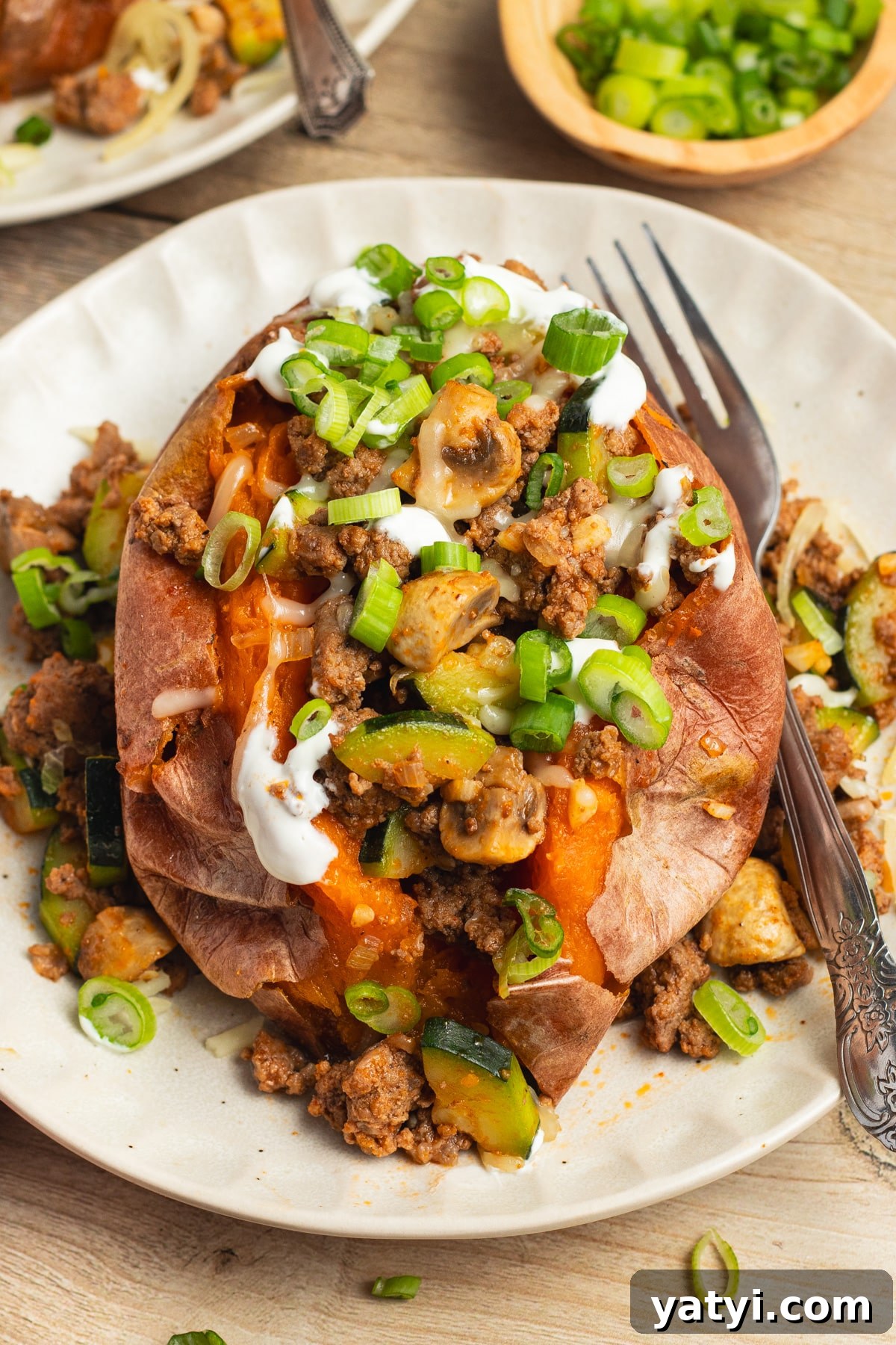 Stuffed Sweet Potatoes with Seasoned Ground Beef and Cheese 9 This is a picture of a ground beef stuffed sweet potato.