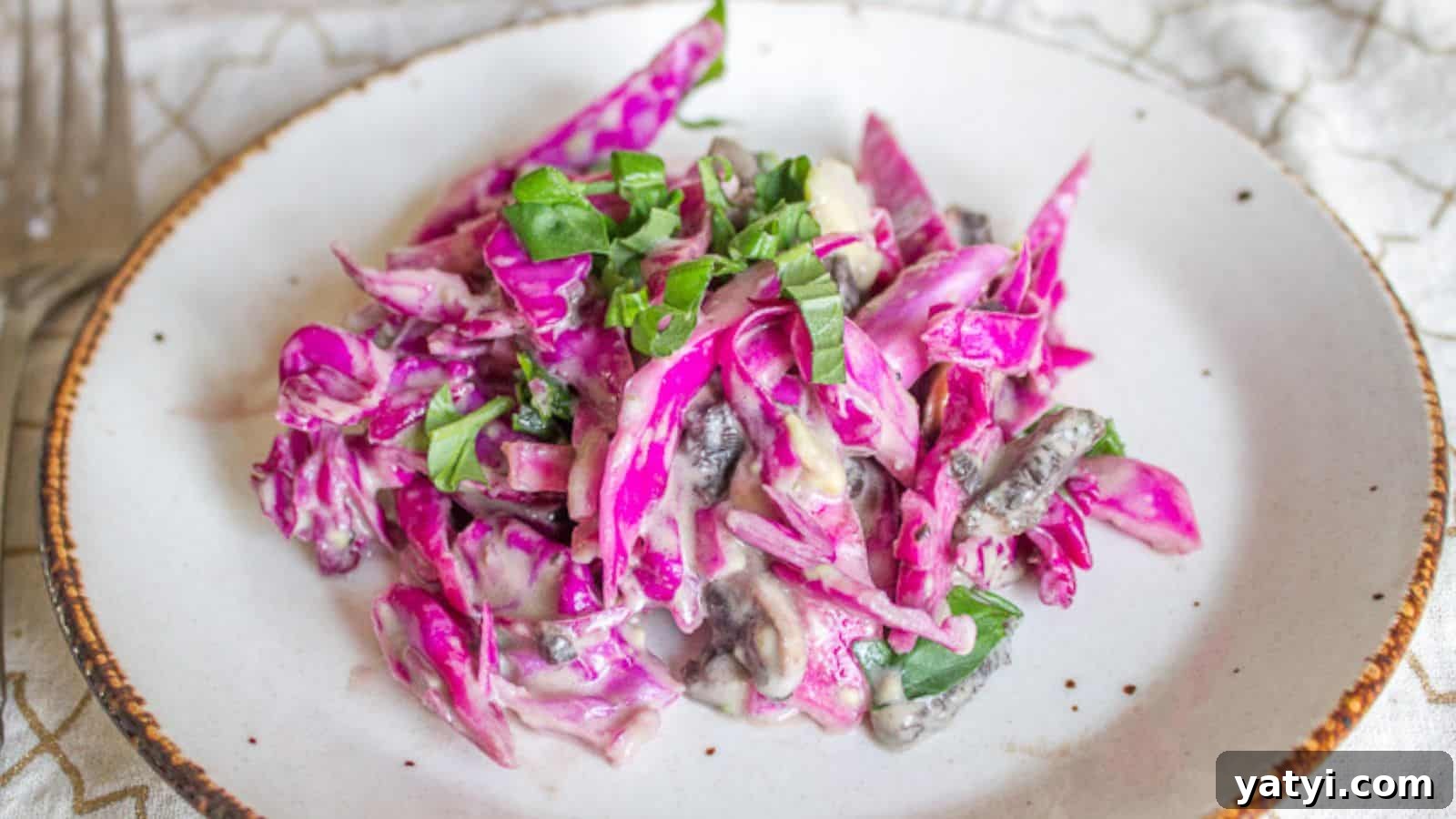 19 Holiday Side Dishes to Balance Your Festive Meal 6 Red cabbage salad on a plate with a fork.