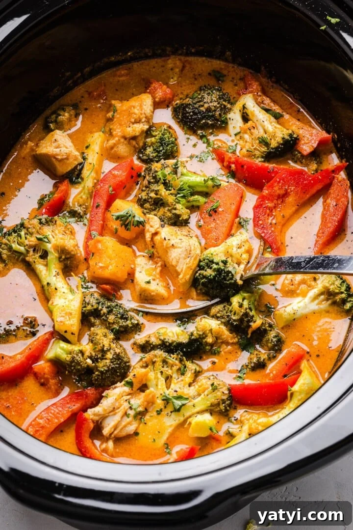 Slow Cooker Thai Red Curry with Chicken and Coconut Milk 2 Slow cooker Thai-inspired red curry with chicken and vegetables in a slow cooker.