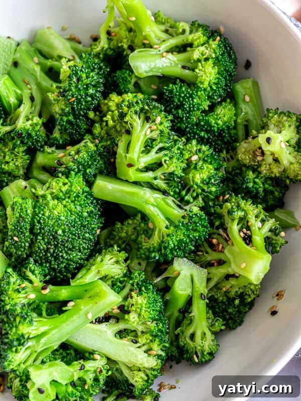 Asian sesame broccoli salad in a white bowl