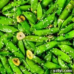 Stir fried sugar snap peas with sesame seeds, garlic, and soy sauce.