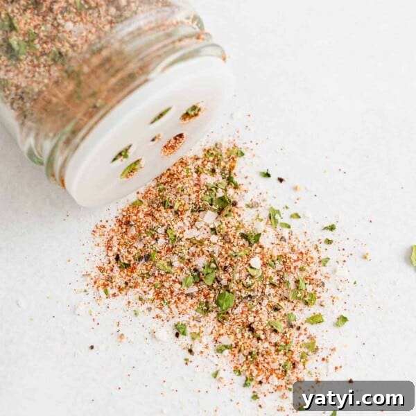 How to Use Cajun Seasoning: Flavor Tips, Recipes & Pairings 13 All purpose seasoning spilling out of a spice shaker.