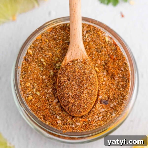 How to Use Cajun Seasoning: Flavor Tips, Recipes & Pairings 14 Overhead view of jar of taco seasoning with a wooden spoon in it.