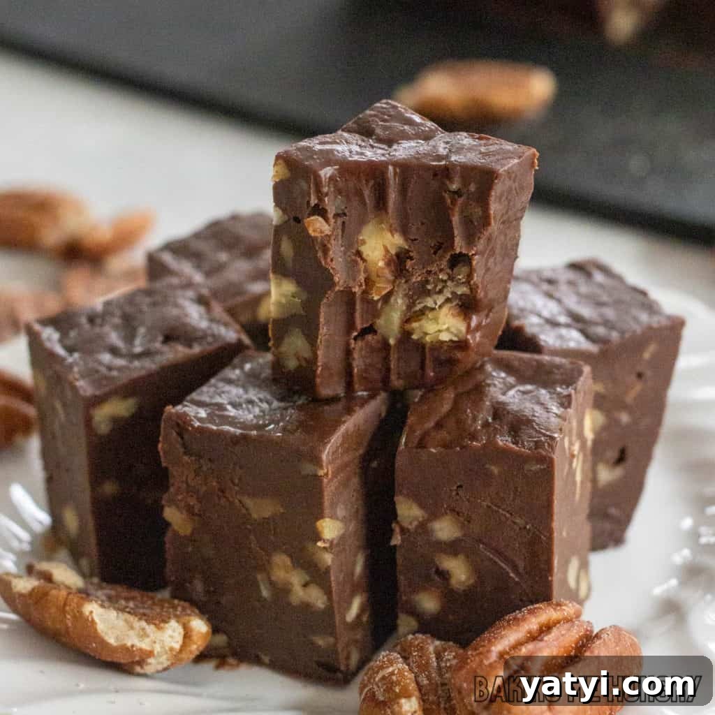 3-Ingredient Microwave Fudge Recipe: Quick Chocolate Fudge 2 3 ingredient microwave fudge on a plate close up with top piece missing a bite