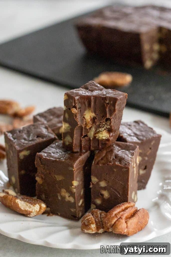 3-Ingredient Microwave Fudge Recipe: Quick Chocolate Fudge 10 3 ingredient microwave fudge on a plate with top piece missing a bite