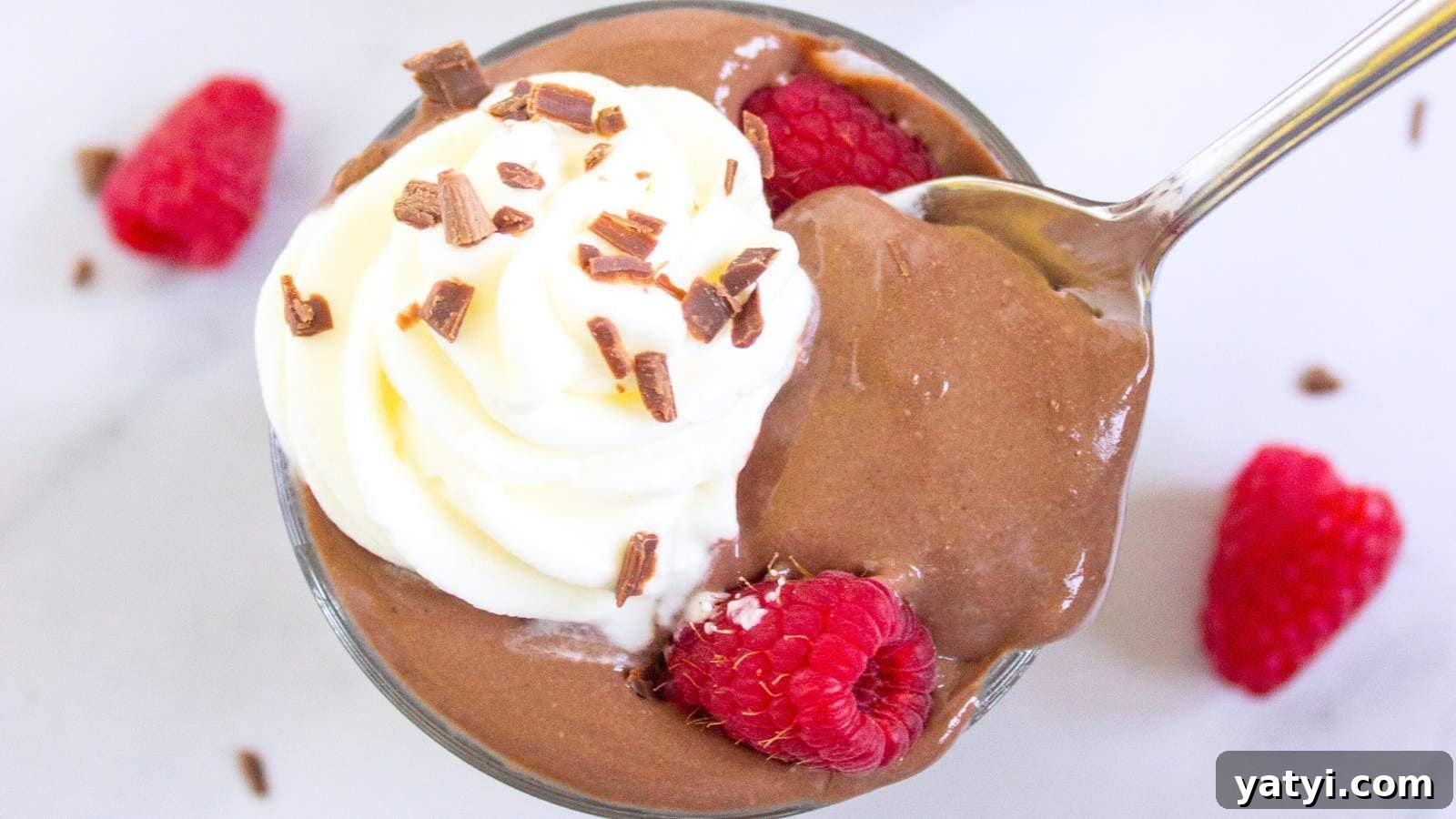 21 Snack Swaps That Beat Junk Food Without Sacrificing Flavor 21 A glass cup filled with protein pudding topped with whipped cream.