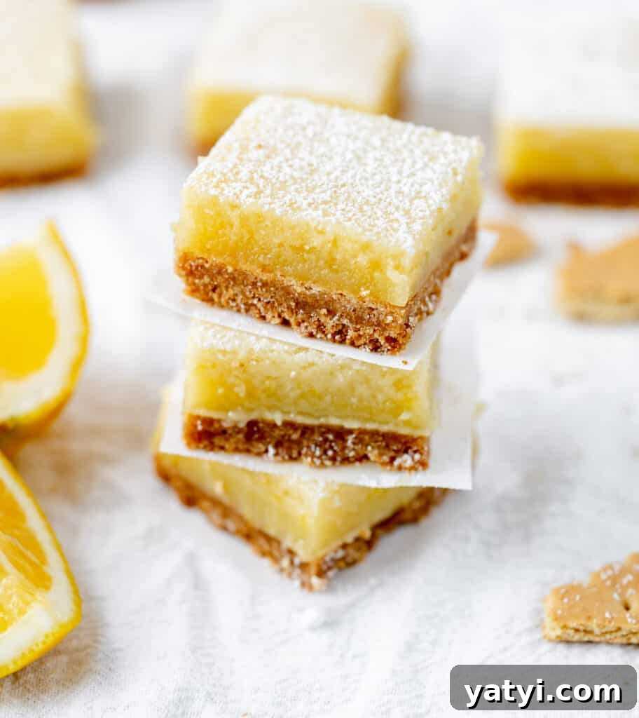 Copycat Starbucks Lemon Loaf Recipe: Moist Citrus Pound Cake Tutorial 12 A stack of tangy lemon bars on a graham cracker crust