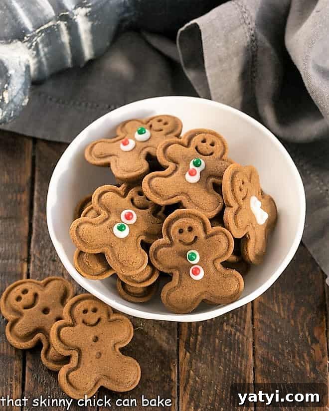 Classic Homemade Gingerbread Recipe: Perfect for Holiday Baking 3 Mini gingerbread men cookies in a small white bowl.
