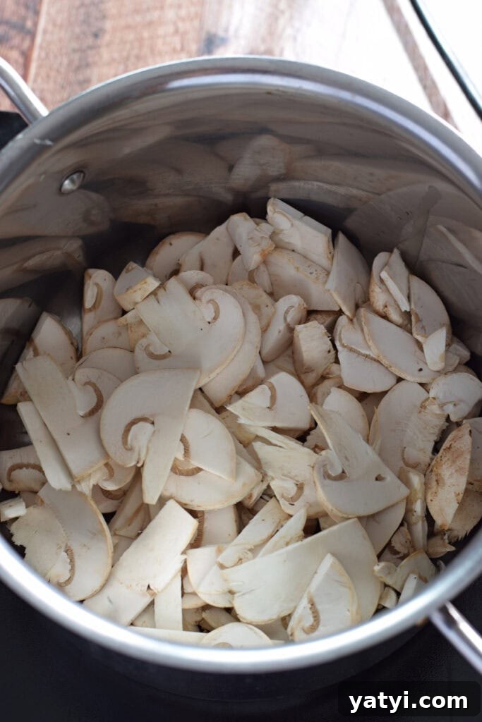 Creamy Mushroom and Leek Risotto Recipe for Cozy Dinners 6 Mushrooms in a saucepan.