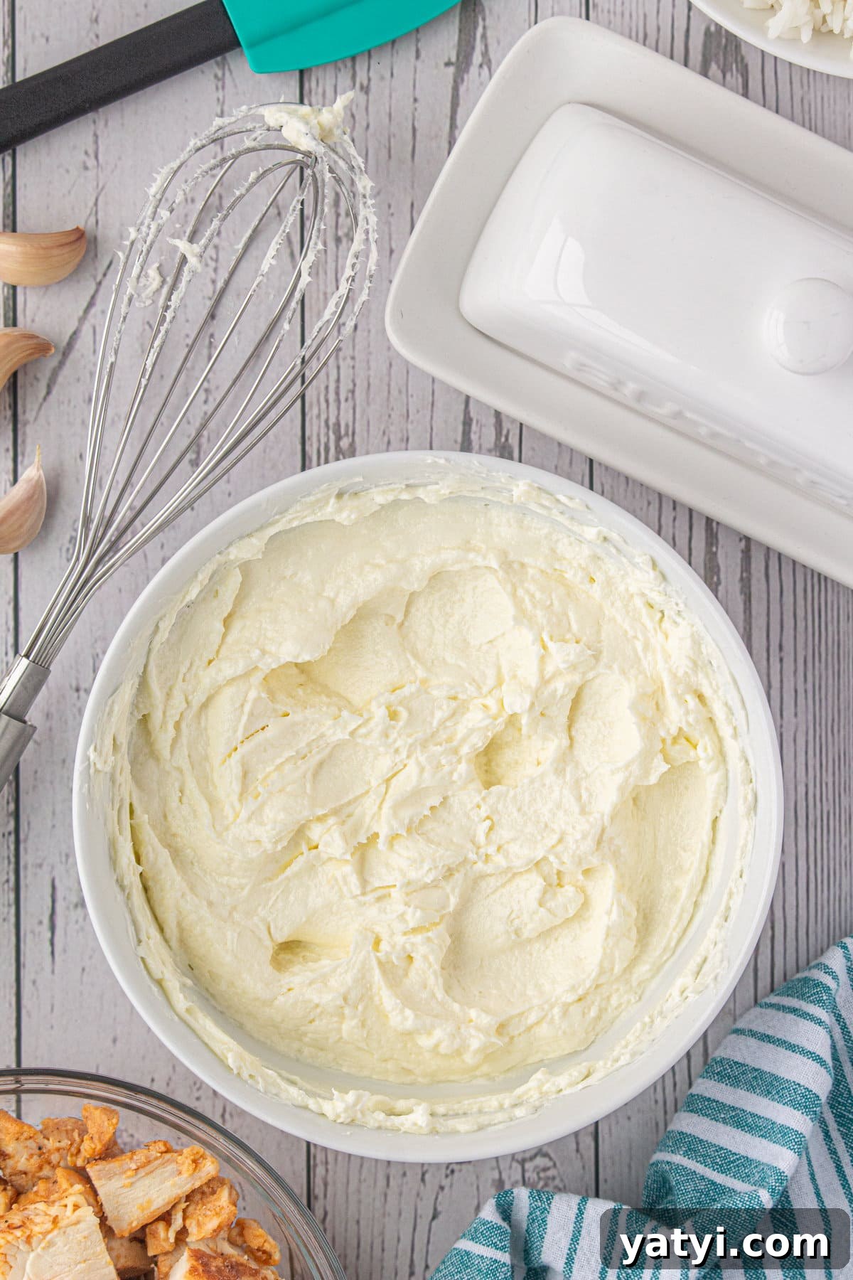 Creamy Angel Chicken and Rice Casserole Recipe 5 Softened butter and cream cheese in a bowl.