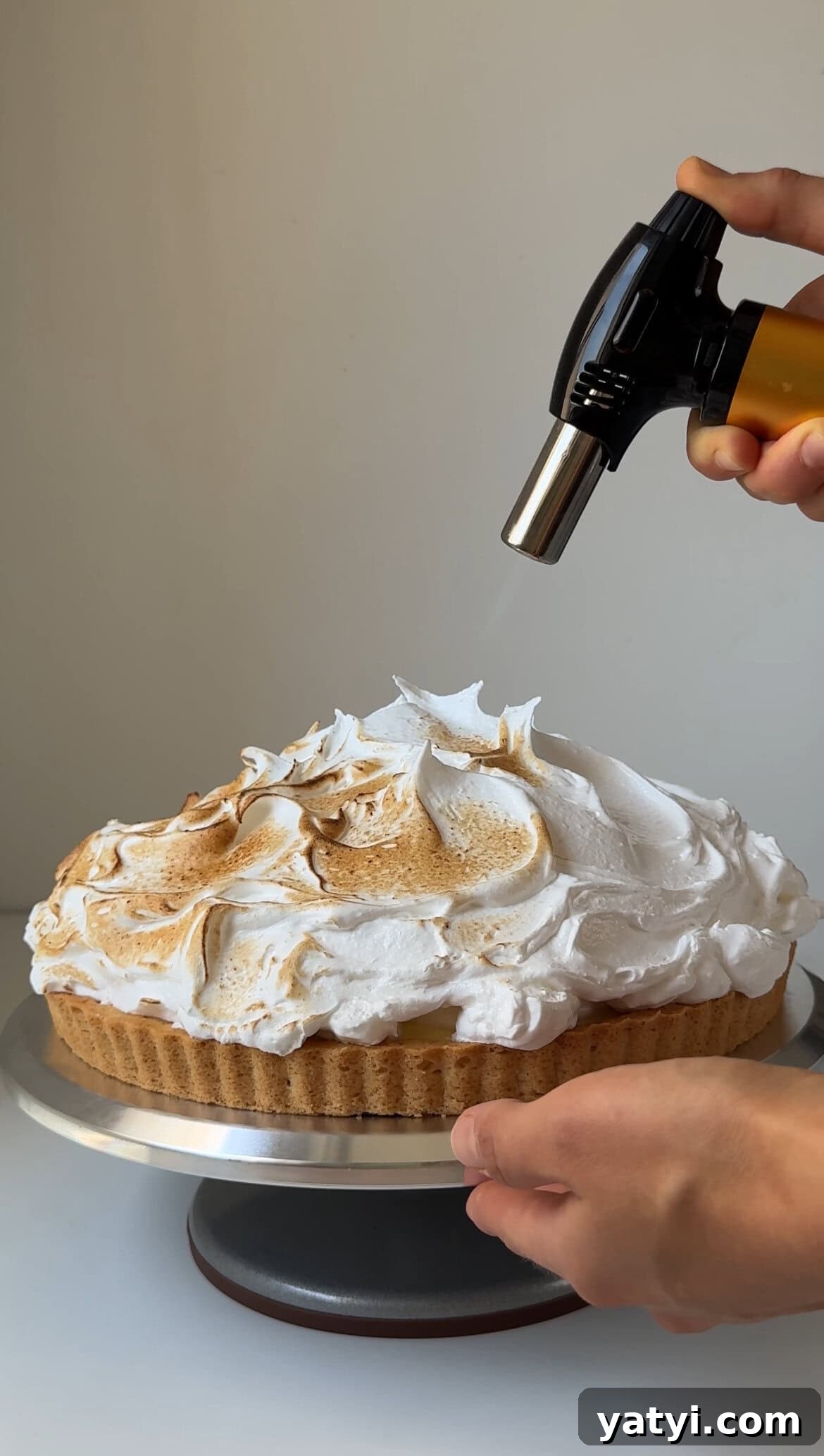 Lemon Meringue Tart Recipe with Crispy Crust and Fluffy Meringue 15 blowtorching lemon meringue tart